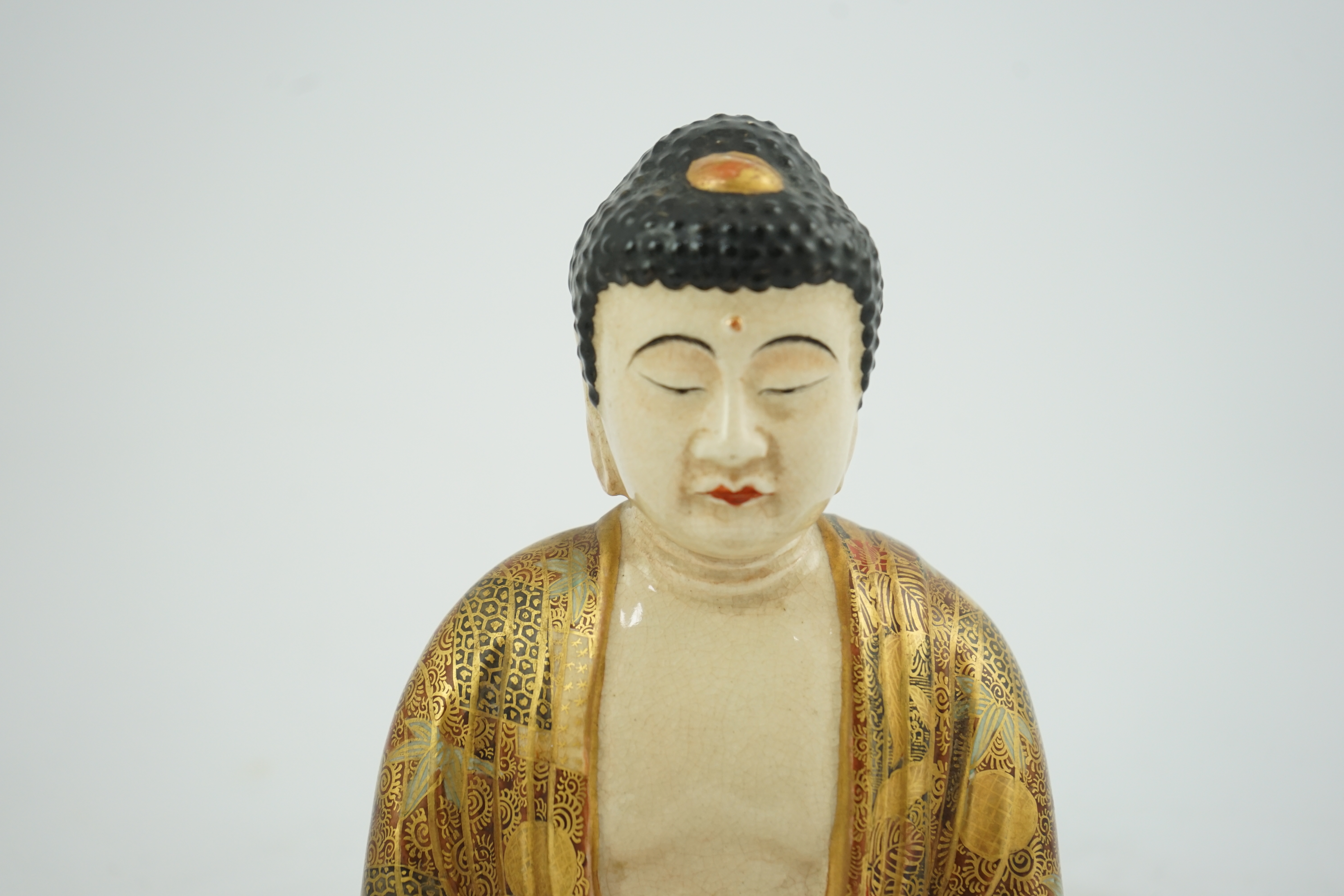 A Japanese Satsuma seated figure of Buddha, Meiji period